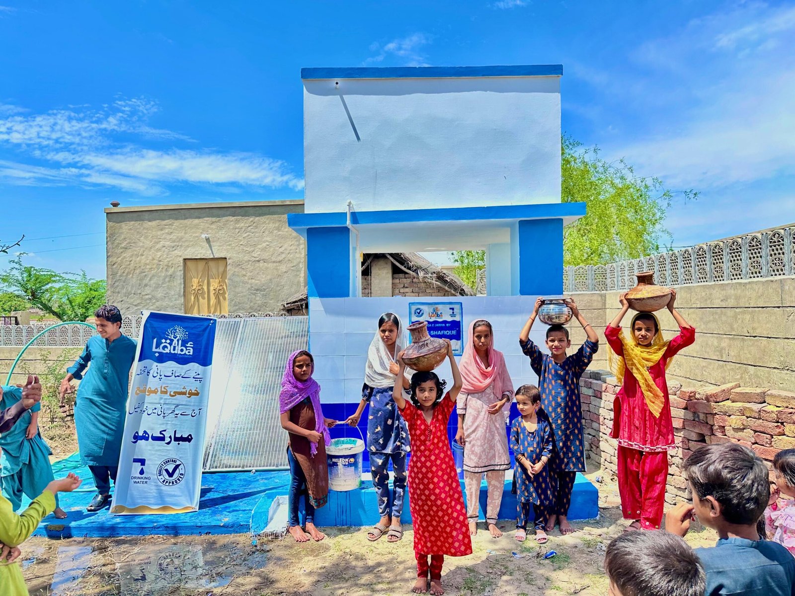 Children carrying water, community support