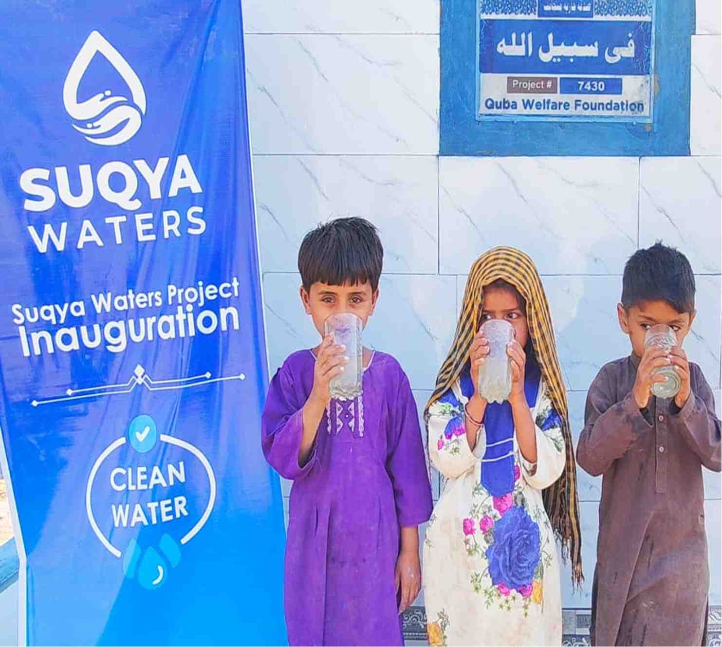 Solar-powered water pump installation with Suqya Waters branding