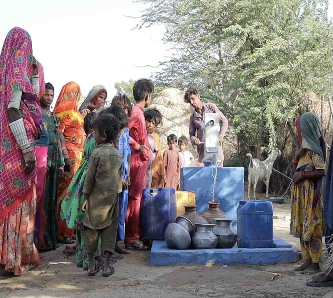 Women and children collecting clean water at Suqya Waters point