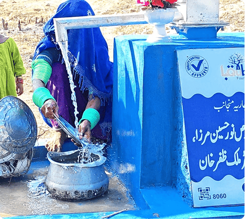 Washing plate with Community Water Hand Pump